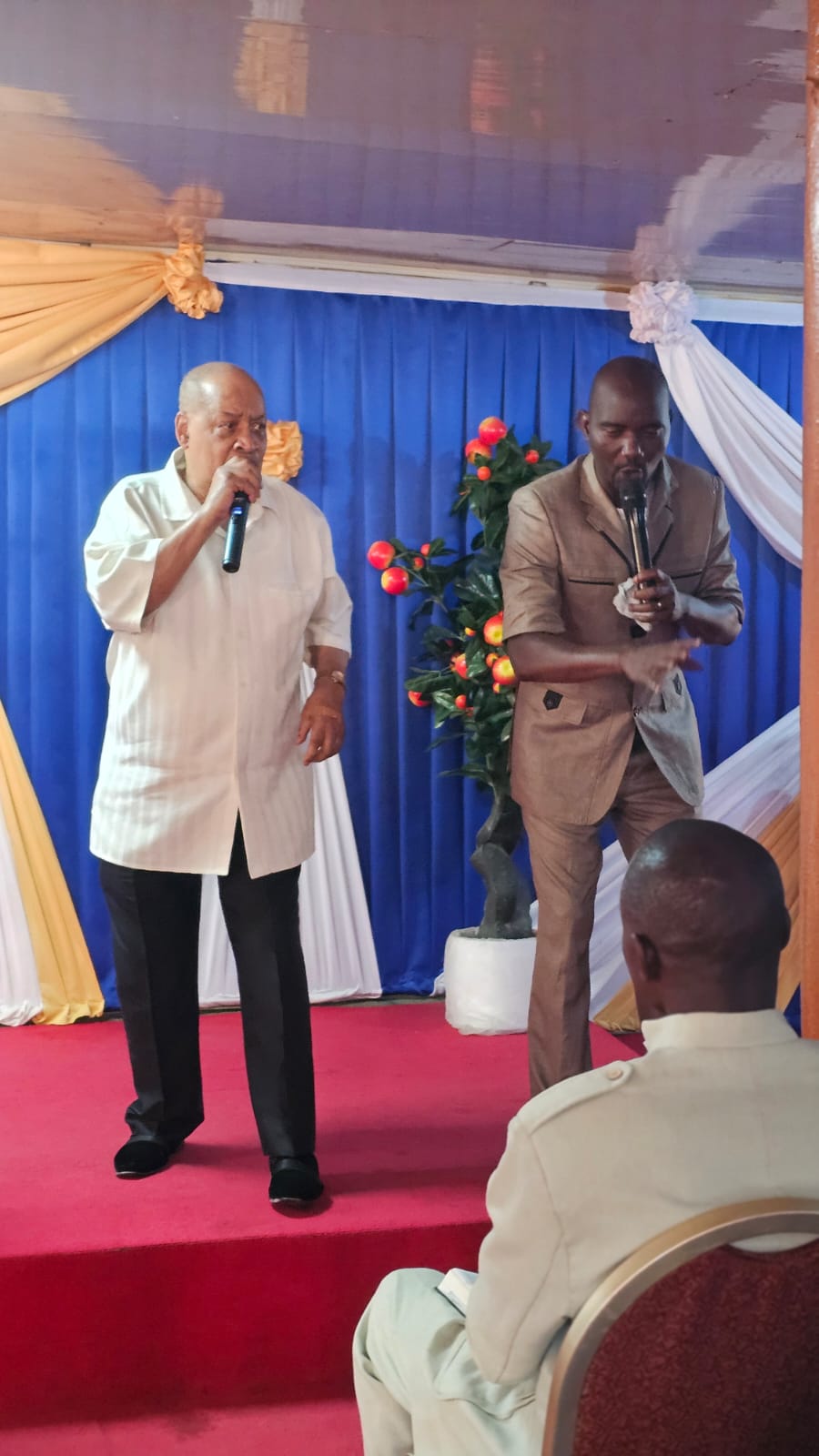 Bishop Butler and associate minister on stage
